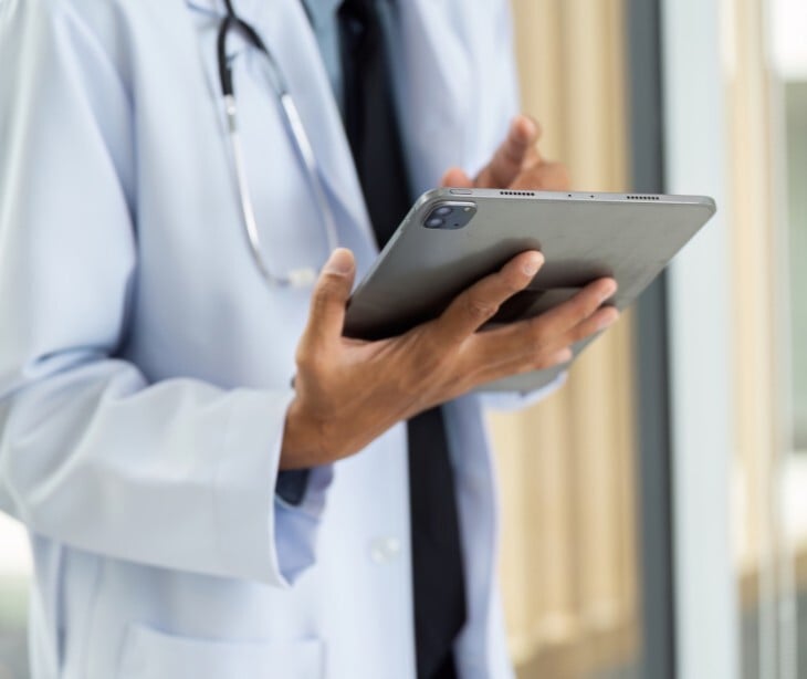 Image of a doctor on a tablet. 