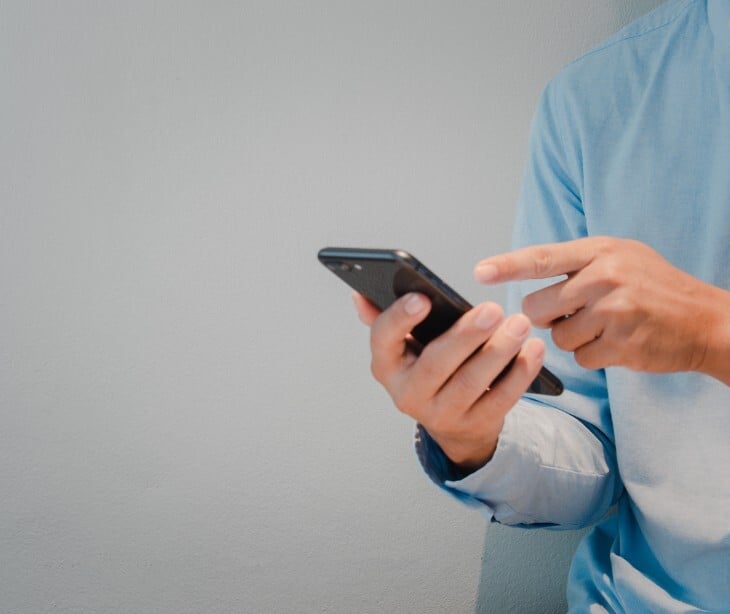 Image of someone texting on the phone. 