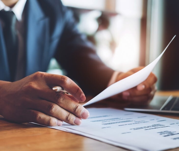 Image of someone looking at papers. 