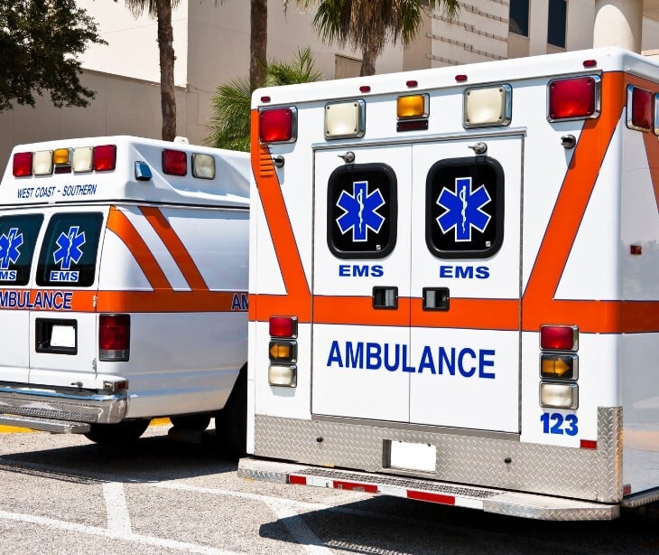 Image of two ambulances parked.