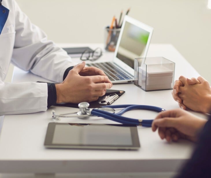 Image of a doctor talking to a patient. 