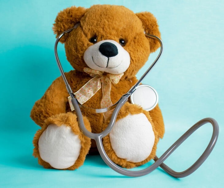 Image of a teddy bear with a stethescope. 