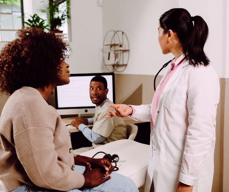 people talking in doctor's office for post Does HIPAA apply to professional medical interpreters?