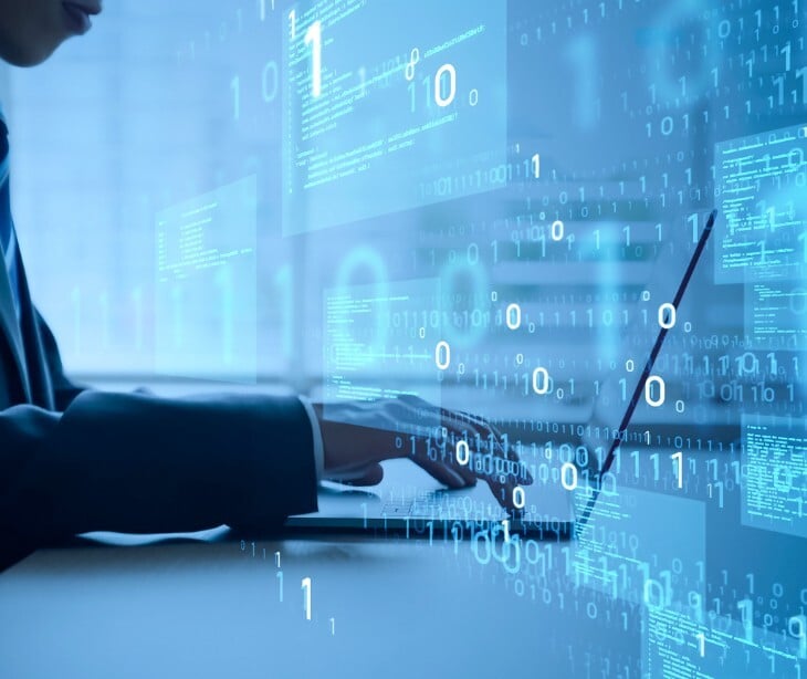 Image of someone typing on a laptop. 