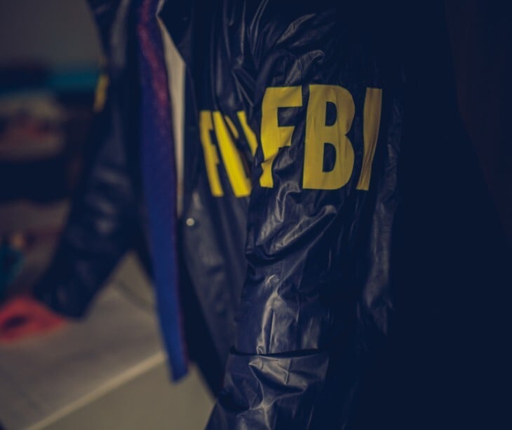 Image of someone in a jacket that says FBI 