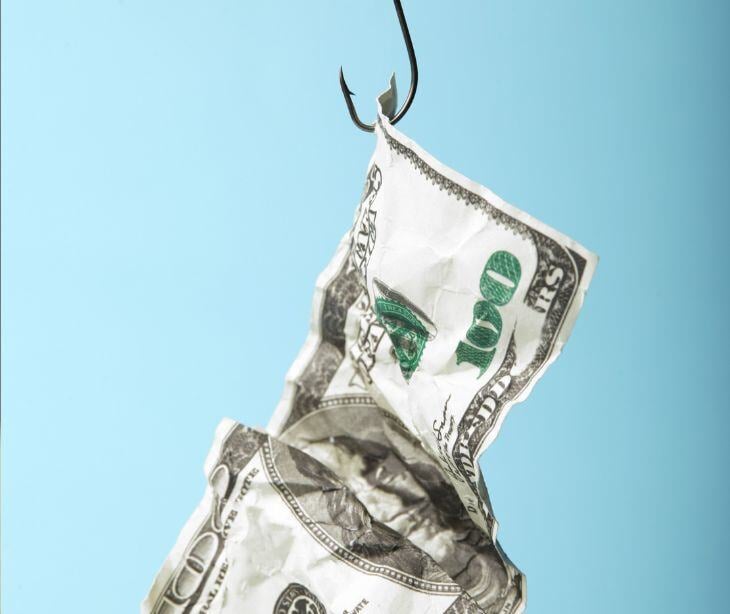 cash bill on fish hook