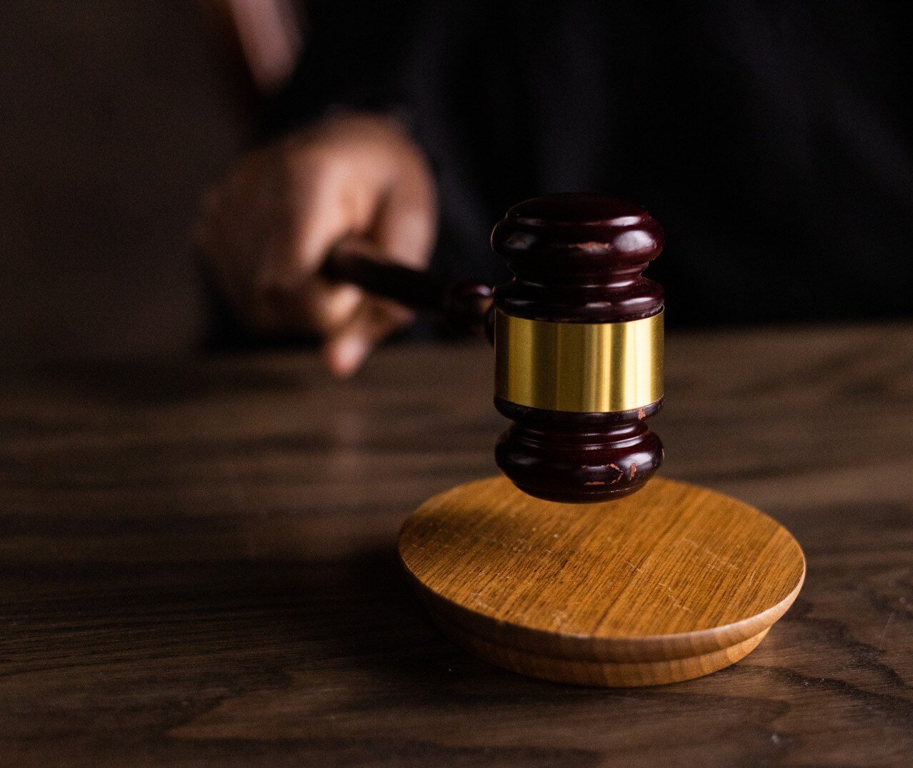 Image of a judge striking a gavel. 