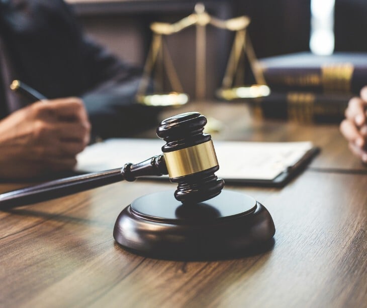 Image of gavel and clipboard. 