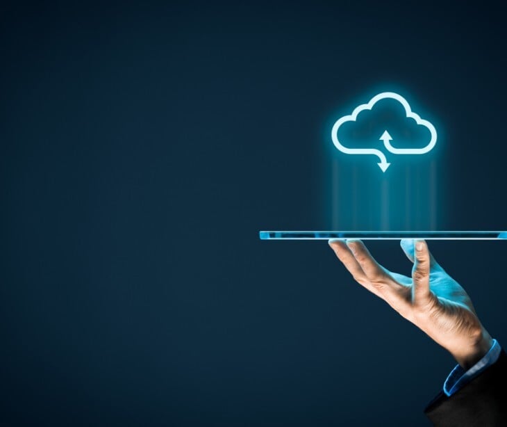 Image of a digital cloud projecting out of a phone. 