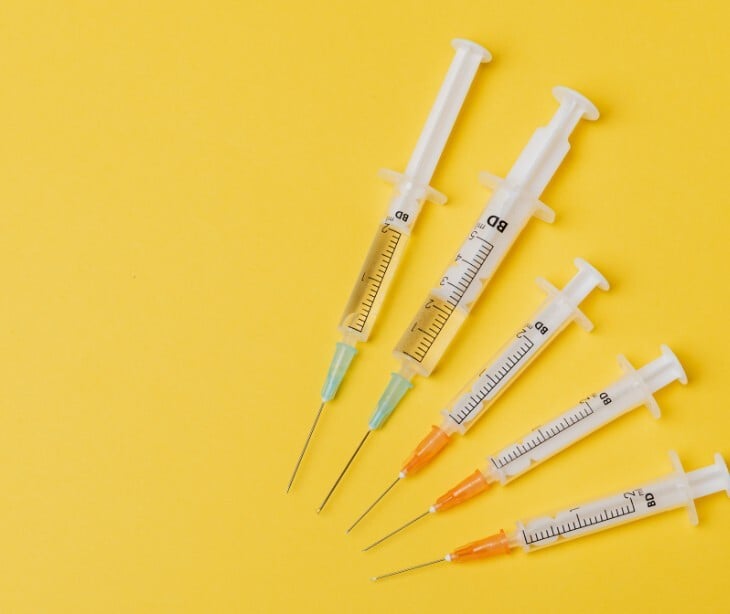Image of vaccines in syringes for administration. 