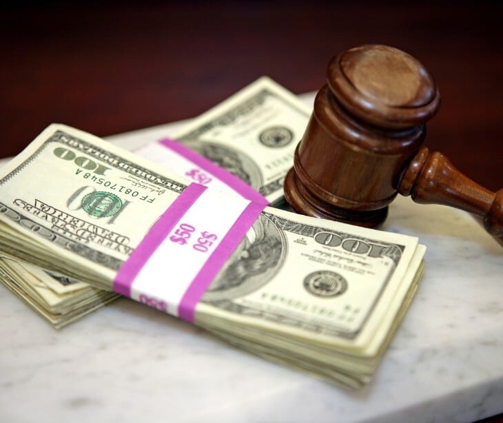 Image of a gavel and of money. 