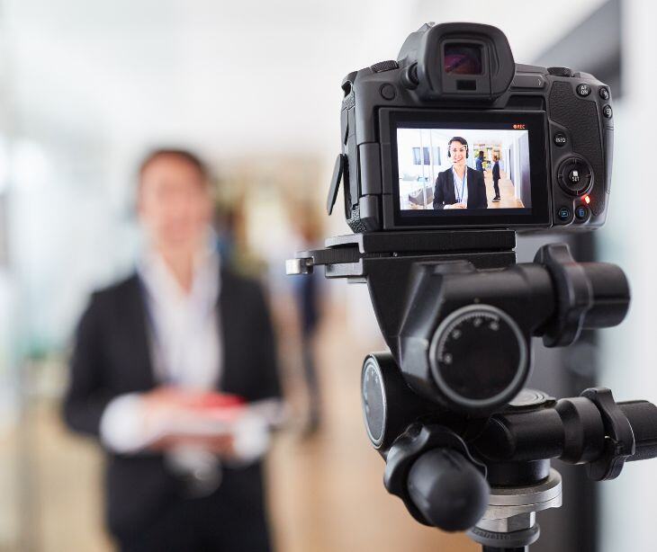 camera filming a person
