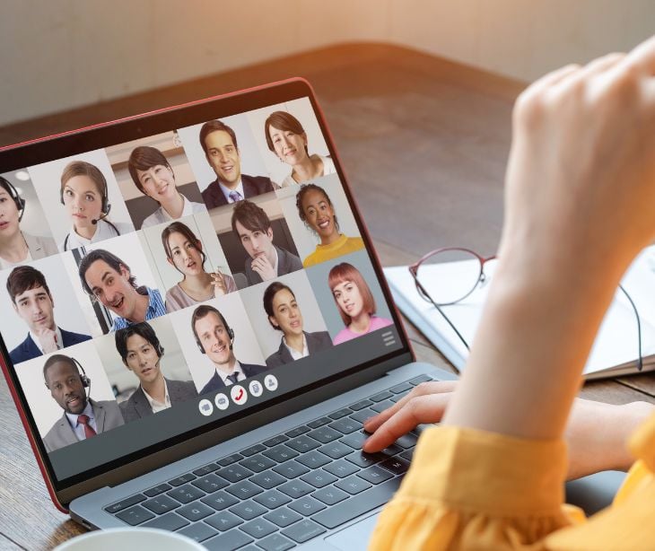 computer screen with multiple people on a video call for post Meeting HIPAA requirements while working remotely