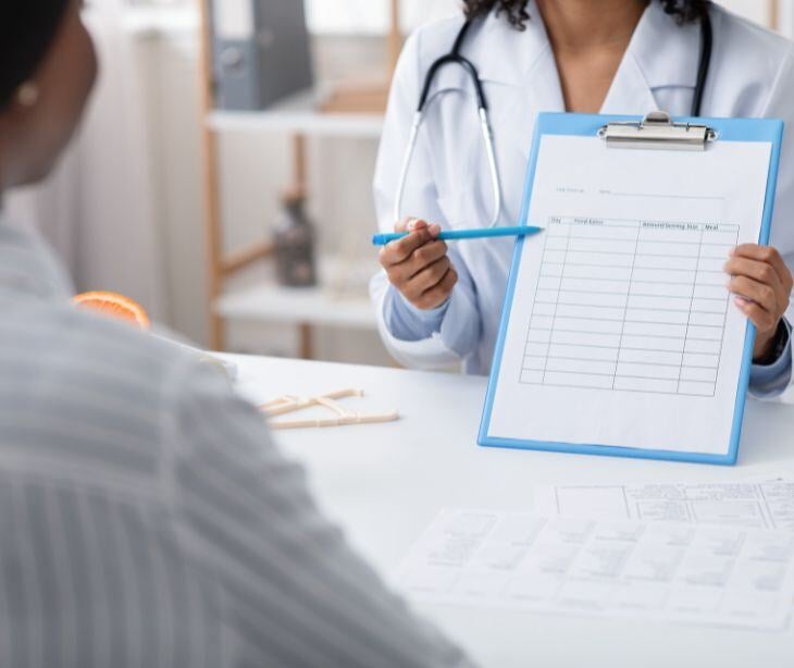 provider pointing at clipboard with pen