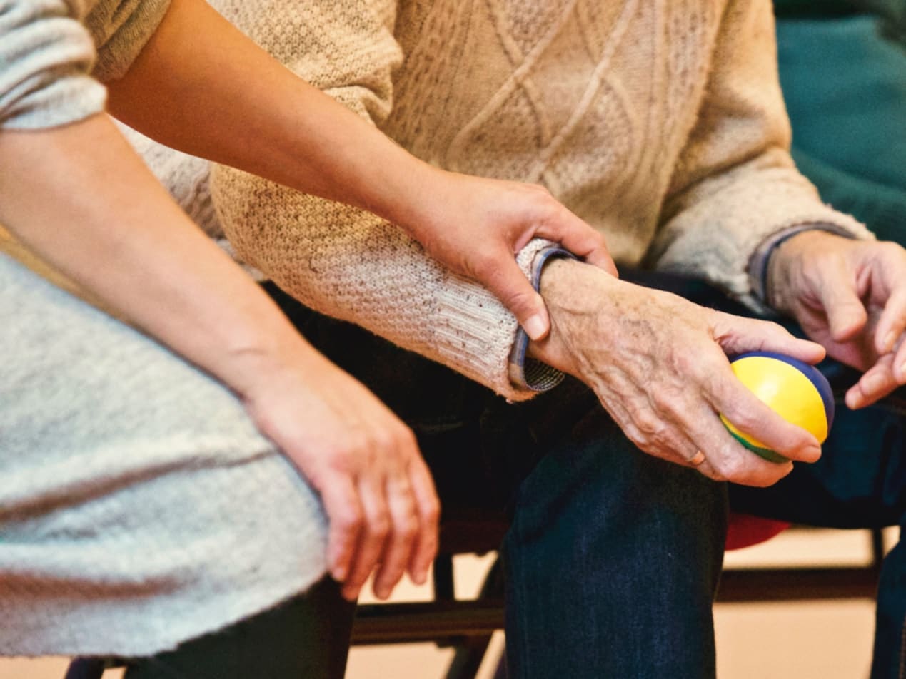 provider touching patient hand