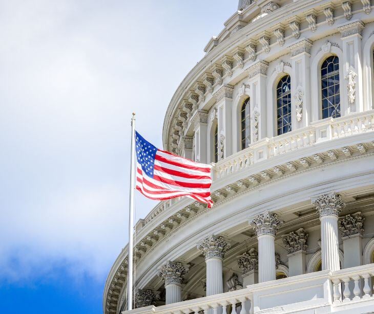 american flag at US capitol building