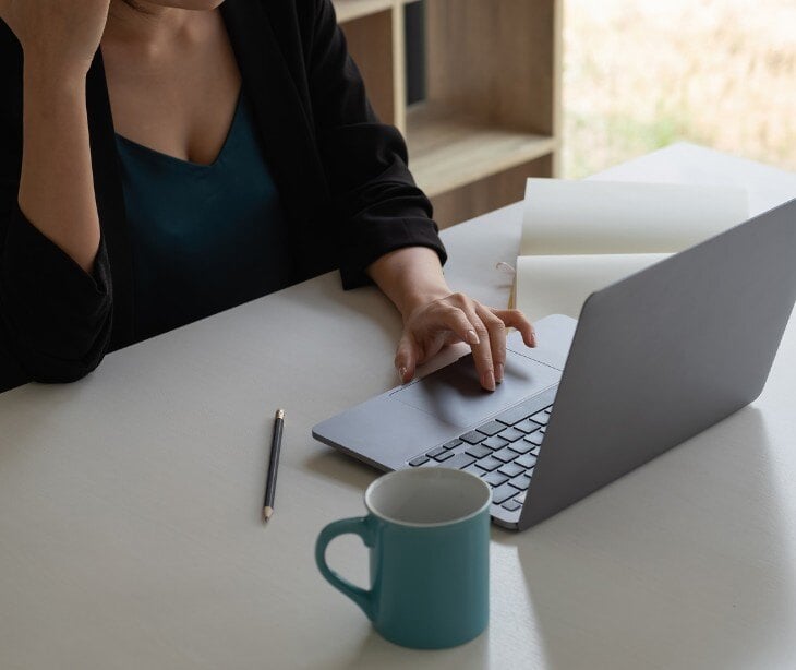 Image of someone on a computer for blog about Using video conferencing for communicating with deaf patients