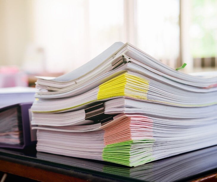 Image of a stack of paper for blog on What are nonrepudiation controls?