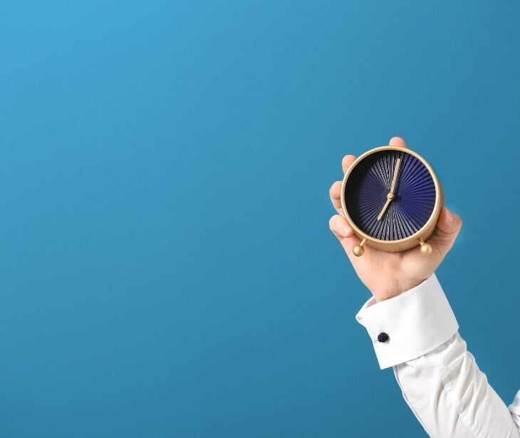 Image of someone holding a clock for blog about Granular retention schedules and HIPAA 