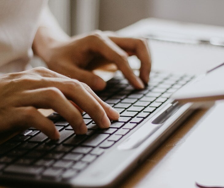 Image of someone typing for blog about Should direct care practices (DCPs) be HIPAA compliant?