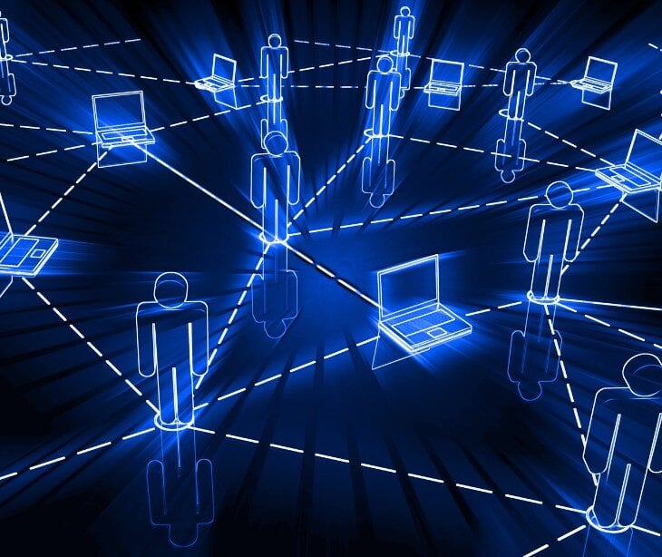 Image of individuals and computers to represent a network for blog about Understanding micro-segmentation