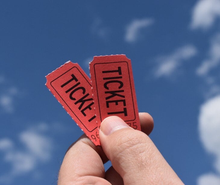 Image of someone holding tickets for blog about What is a golden ticket attack?