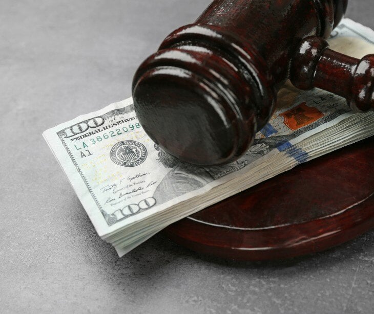 Image of gavel and money for blog about HIPAA violation fines 