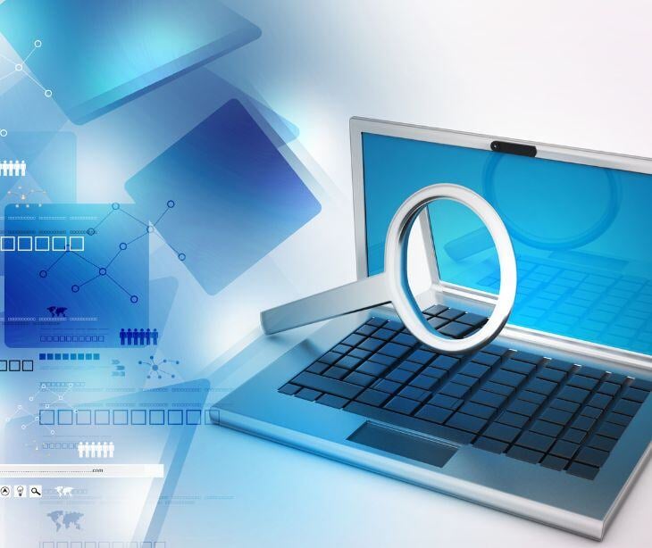 magnifying glass on laptop