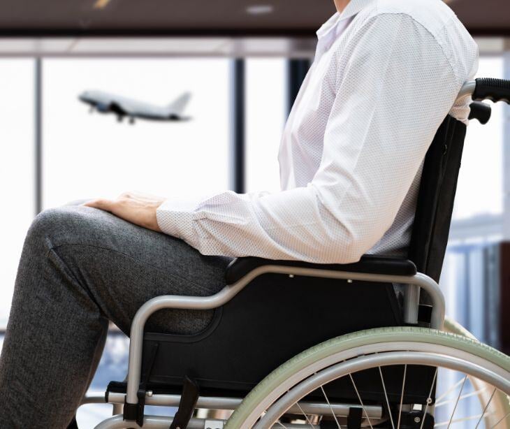 person in wheelchair at airport