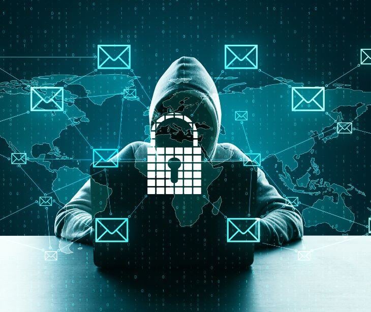 representation of hacker surrounded by floating email icons