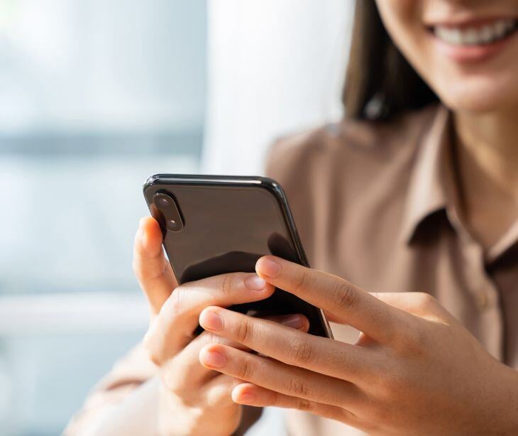 woman holding smartphone