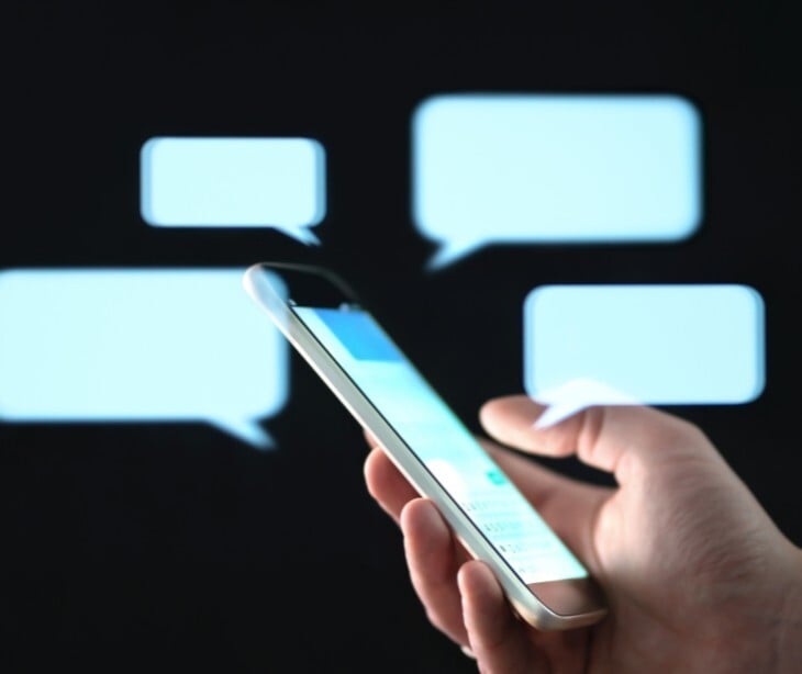 Image of someone looking at text messages. 