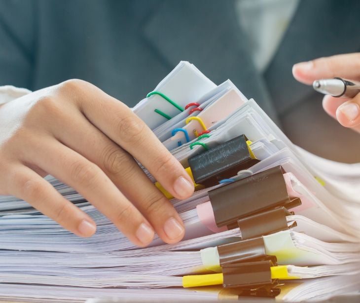 hands going through paperwork