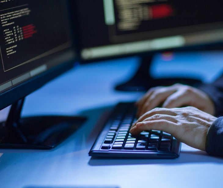 depiction of hacker on keyboard
