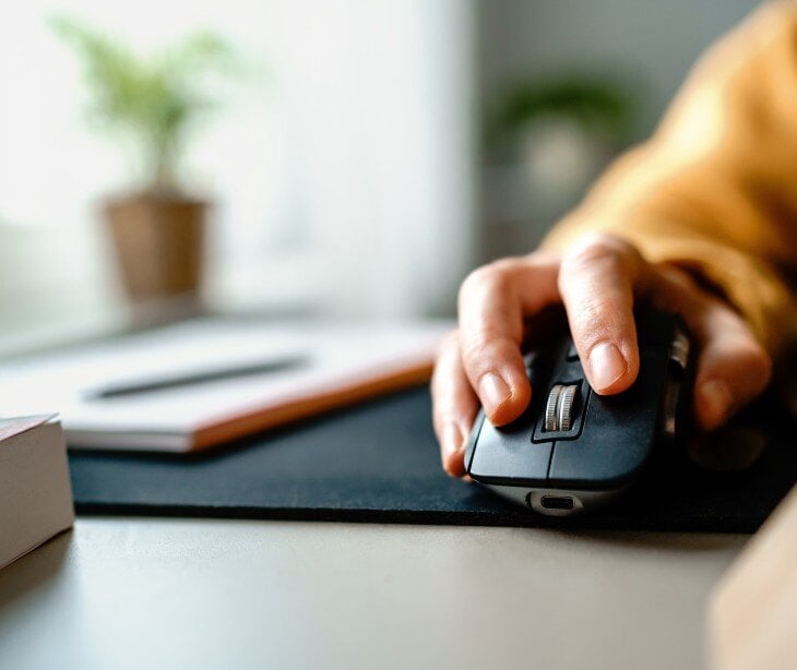Image of someone using a computer mouse.