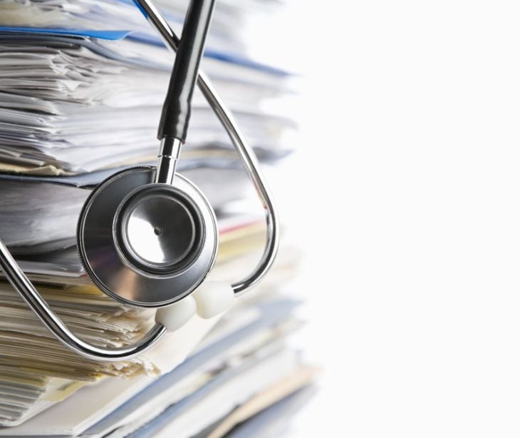 stack of paper with stethoscope