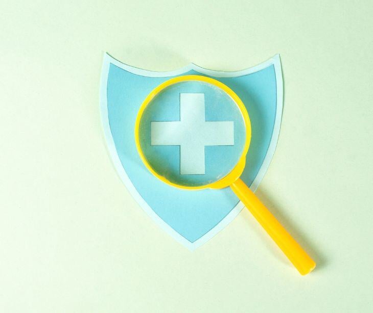 magnifying glass over medical symbol