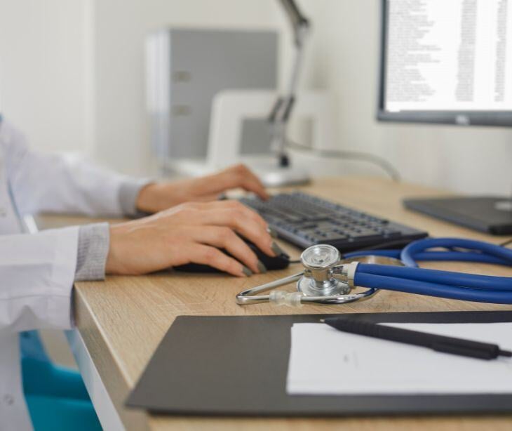provider at computer for post When is accessing medical records a HIPAA breach?