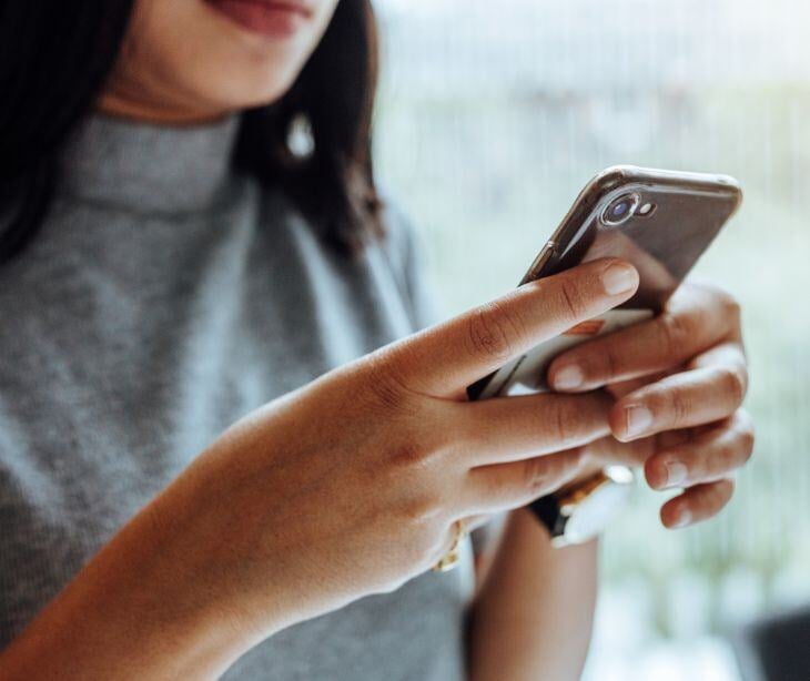 woman holding smartphone